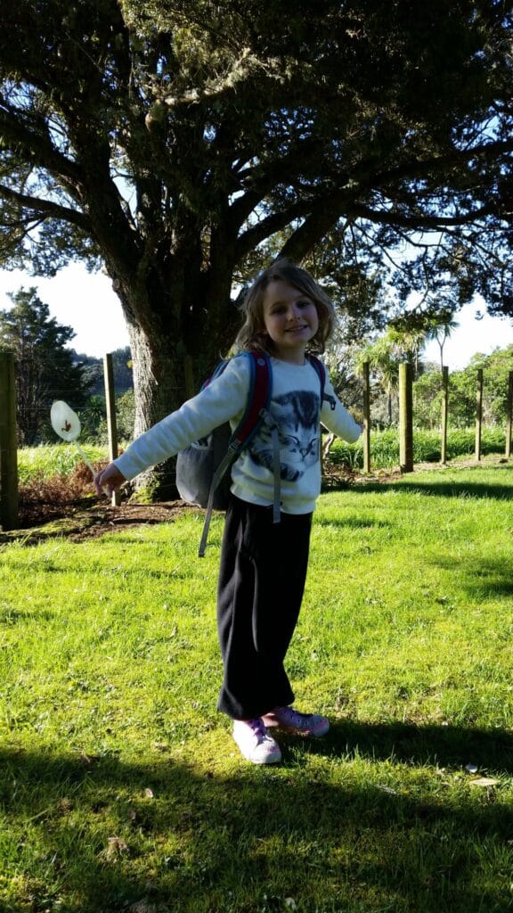 A springtime photograph of Jolan at the school bus stop
