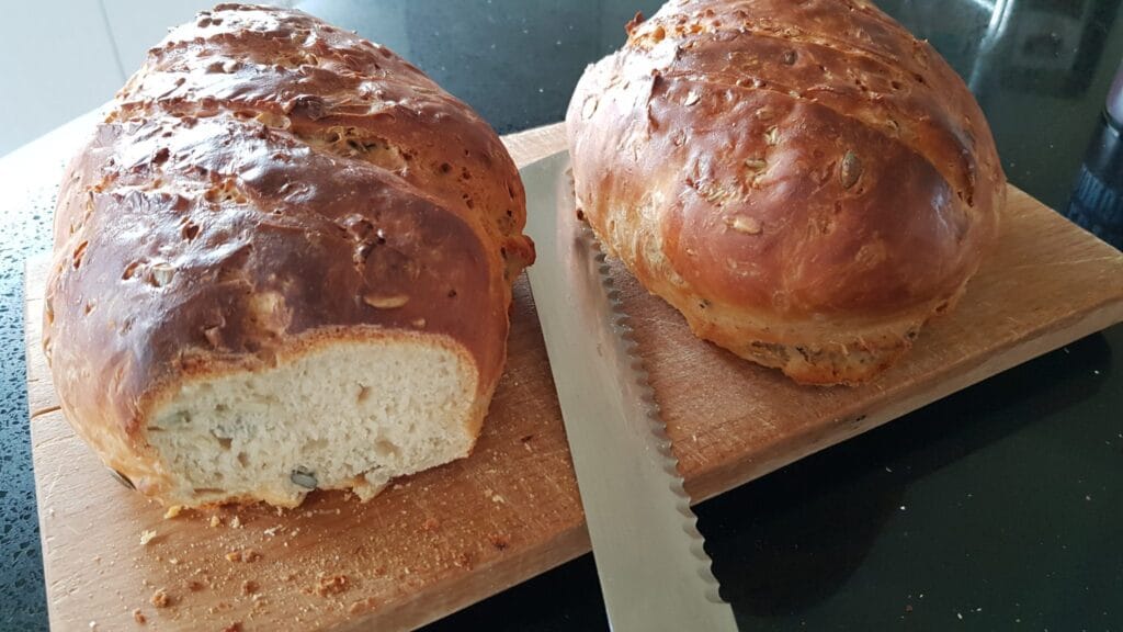 Two breads on a cutting board