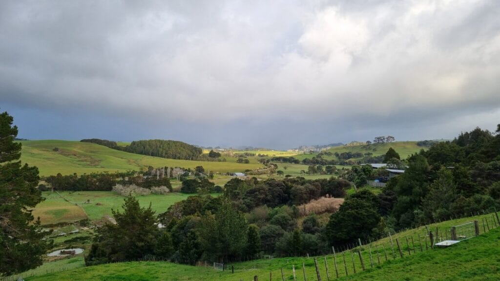 Valley view with patches of sunshine and rainclouds