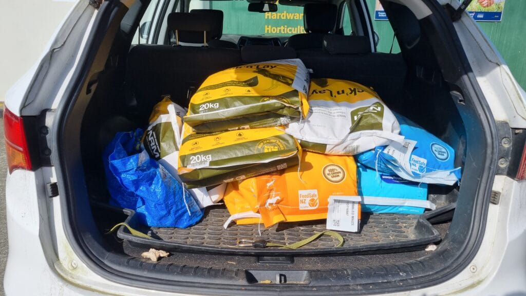 Car boot full of feed bags